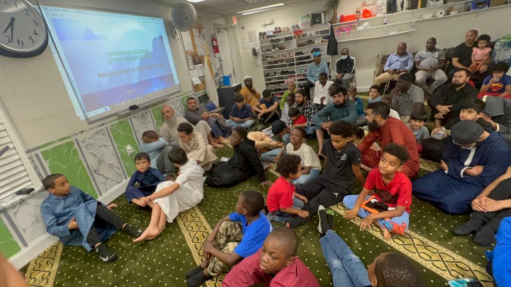 Members of the Haskay community gathering at the masjid